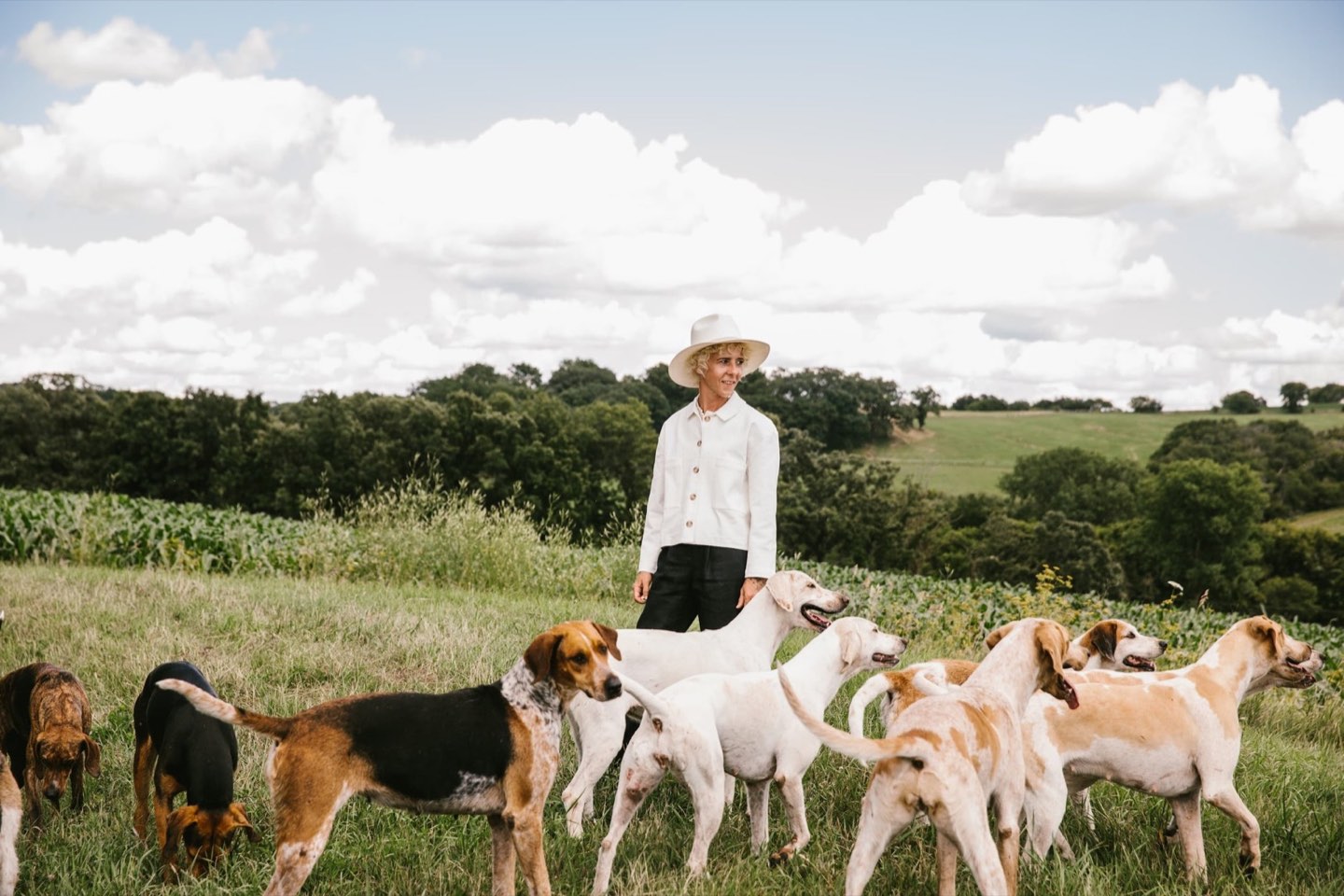 Sasha Armstrong with her pack on the open farm pasture